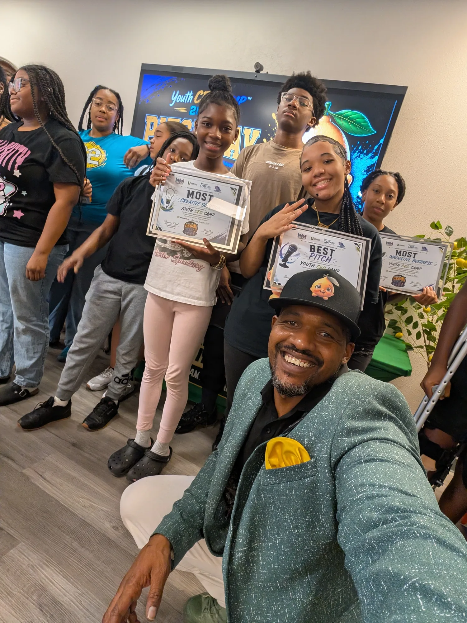 Founder Brandon Ward with award-winning young CEOs holding Most Creative Solution, Best Pitch, and Most Innovative Business certificates on Pitch Day