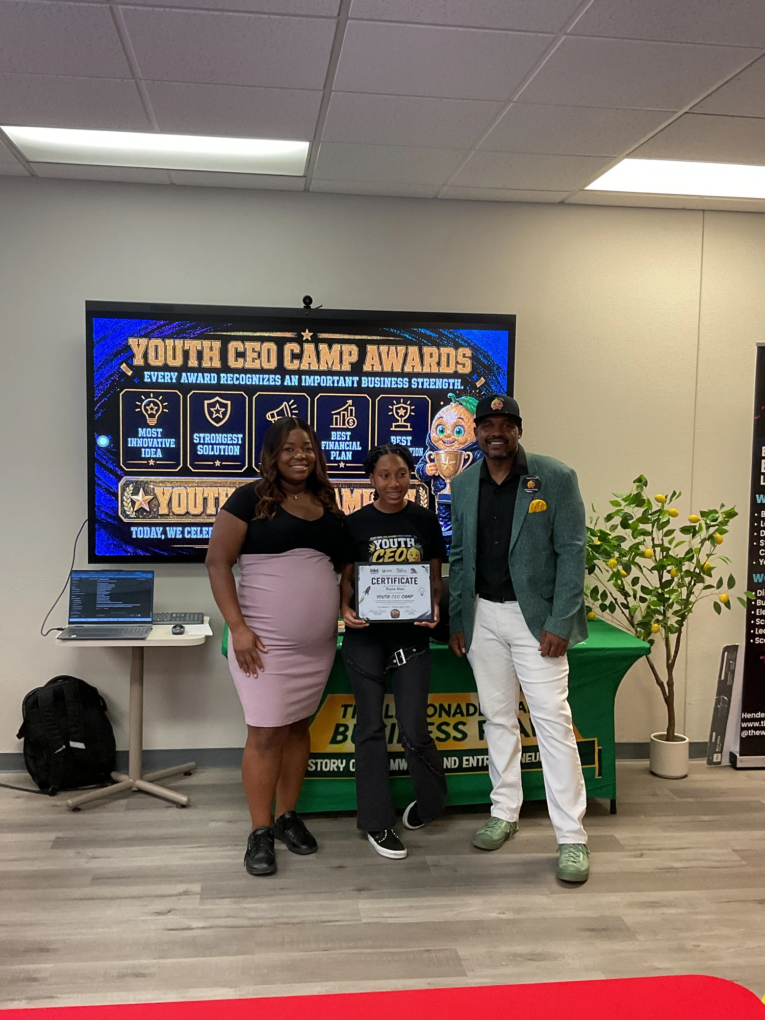 Reyna Allen receiving her Youth CEO Camp certificate